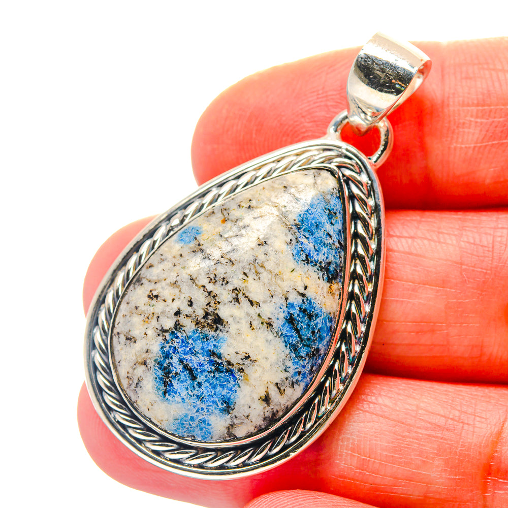 Sterling silver teardrop azurite pendant with ornate rope border and bail, blue stone
