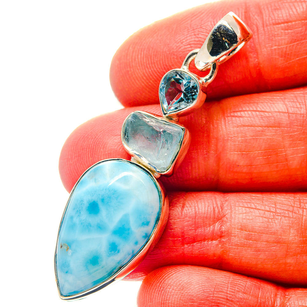 Three-stone 925 sterling silver pendant with oval Larimar cabochon and blue gems