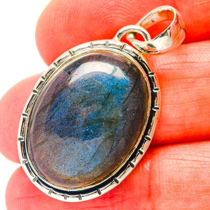 Oval labradorite pendant in 925 sterling silver bezel with hinged bail, deep blue flash