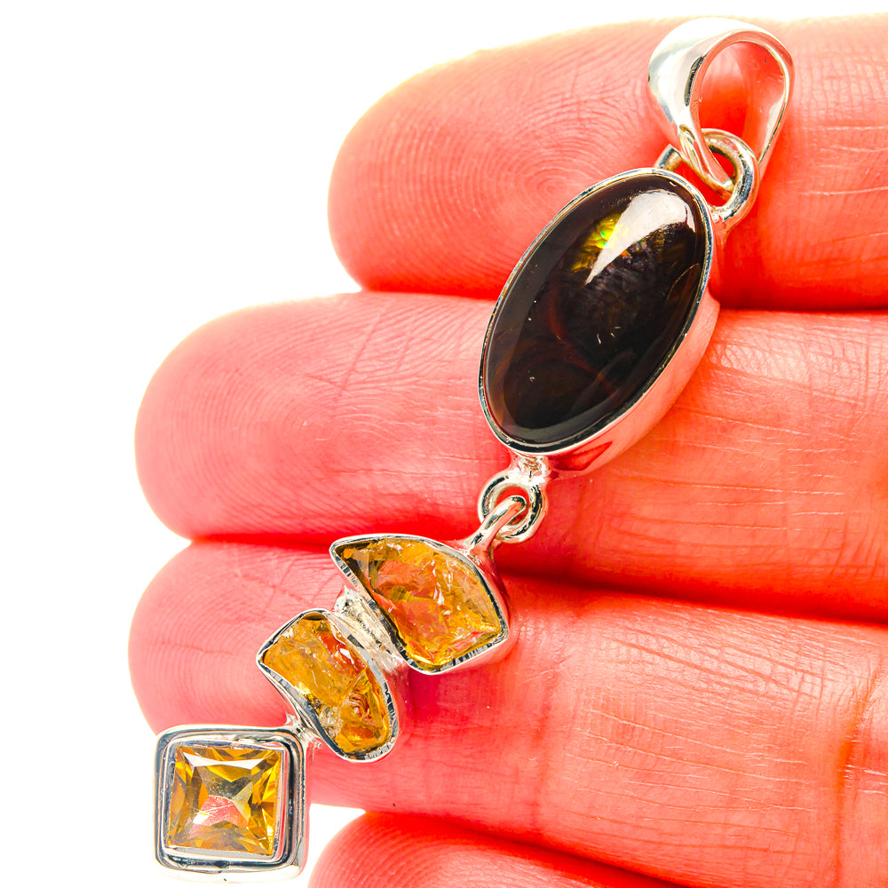 Sterling silver pendant with dark amber oval gemstone and three yellow citrine squares