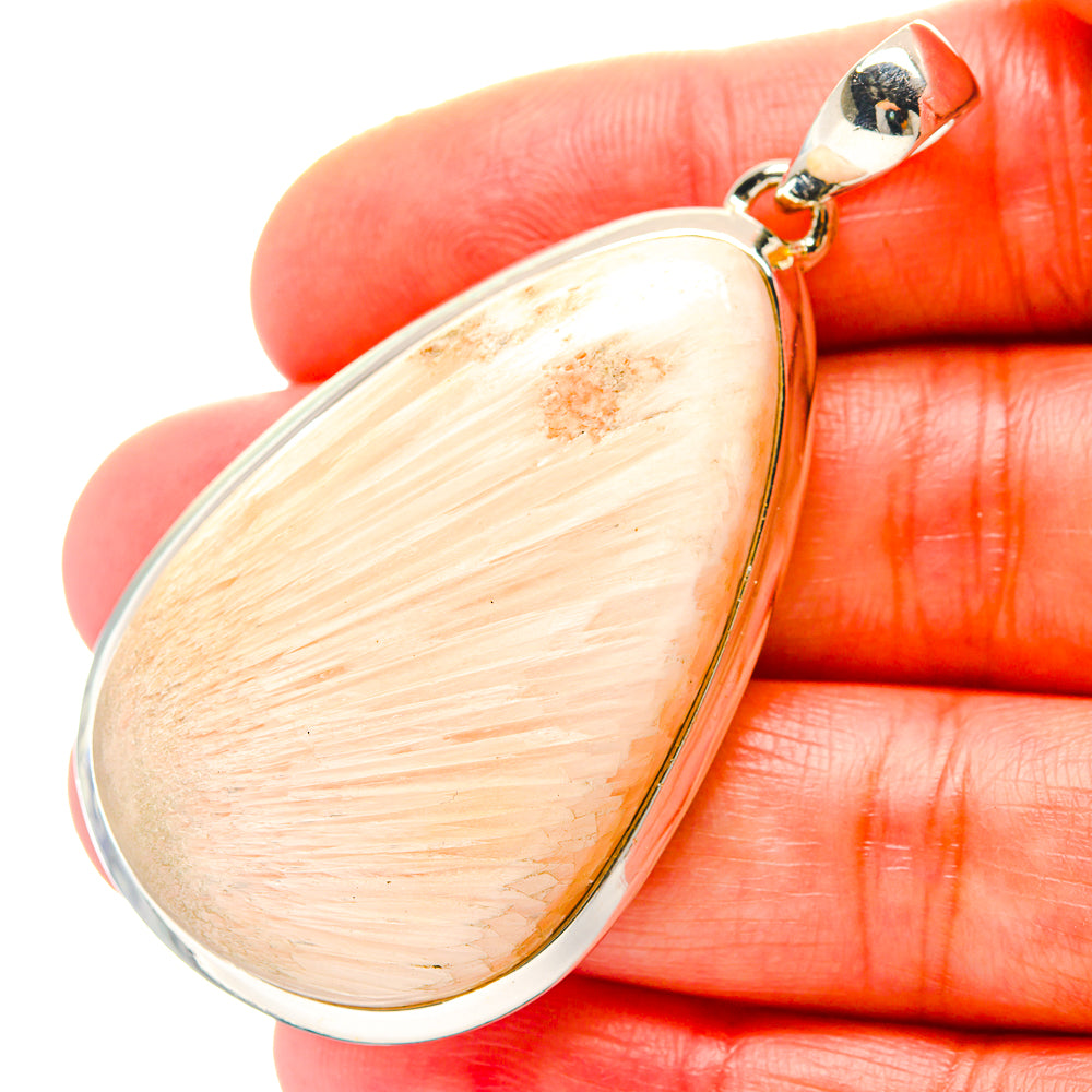 Peach teardrop gemstone pendant with sterling silver bail, close-up
