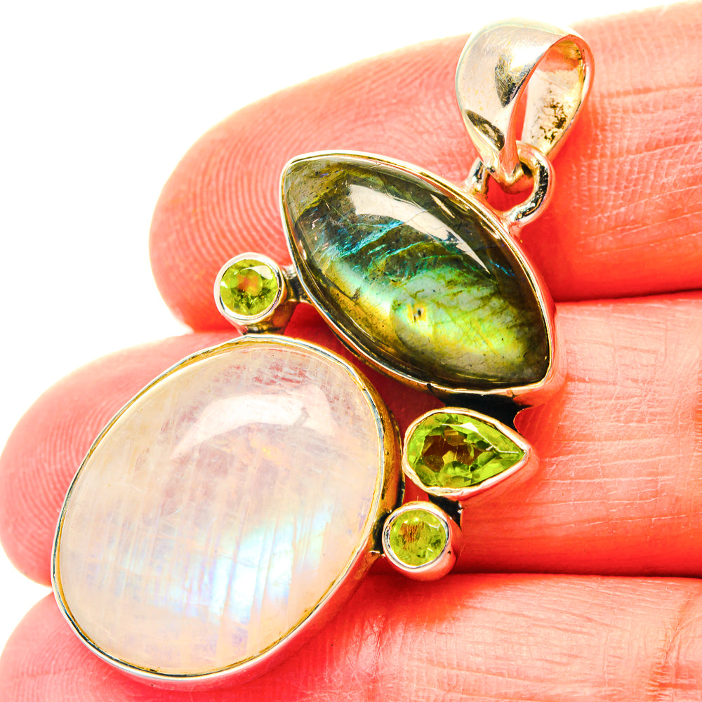 Sterling silver pendant with labradorite and moonstone ovals, surrounded by peridot stones
