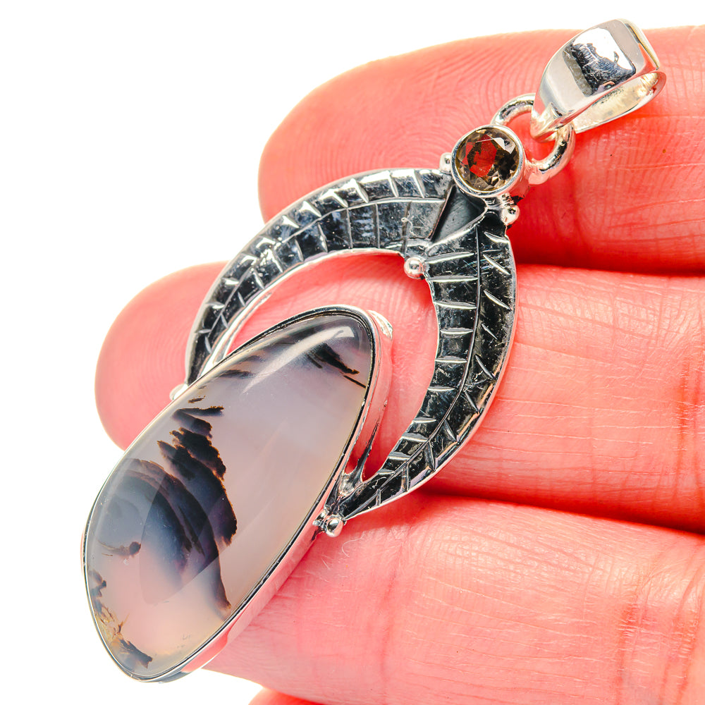 Oval smoky quartz pendant in 925 sterling silver with dark round accent and bail