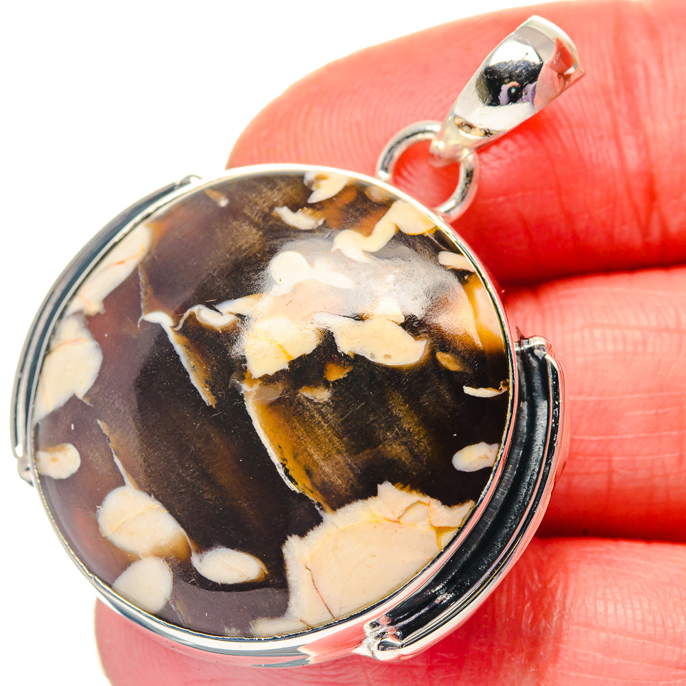 Oval jasper pendant with silver bezel, brown-orange stone with cream patches and loop