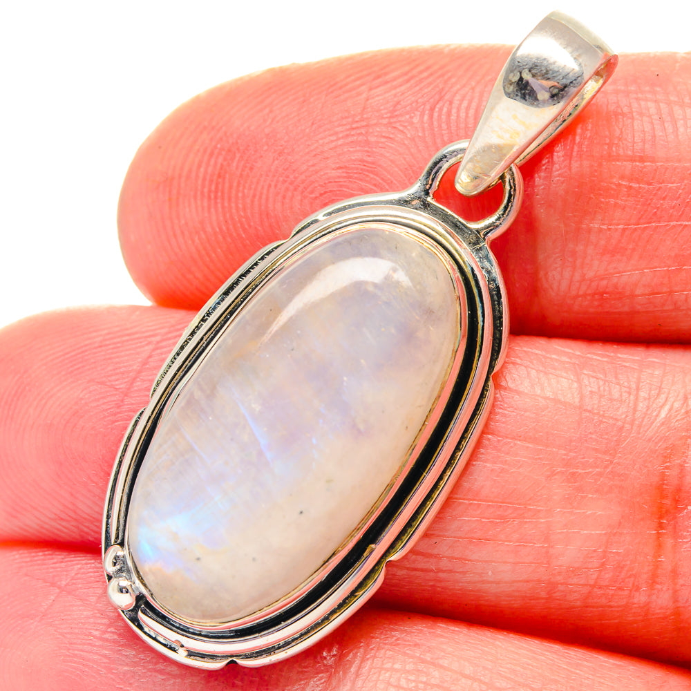 Oval rainbow moonstone pendant in oval sterling silver bezel with top bail