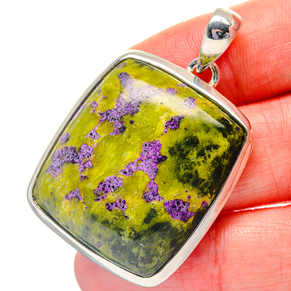 Sterling silver pendant with square green stone and purple flecks, bail at top