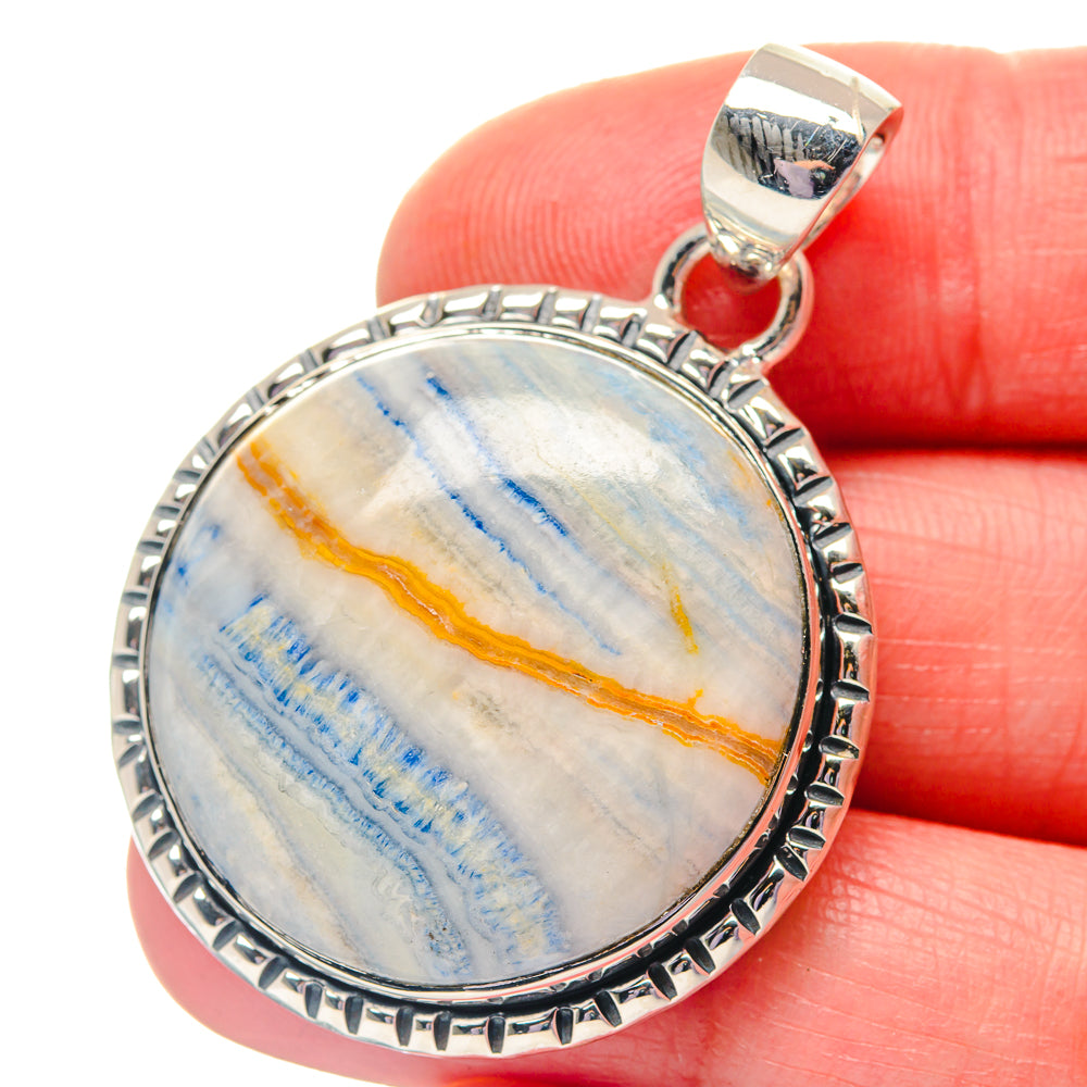 Blue scheelite oval pendant in 925 sterling silver with detailed bezel and loop bail