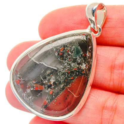 Bloodstone pendant in teardrop frame, red and green speckled stone on sterling silver bail