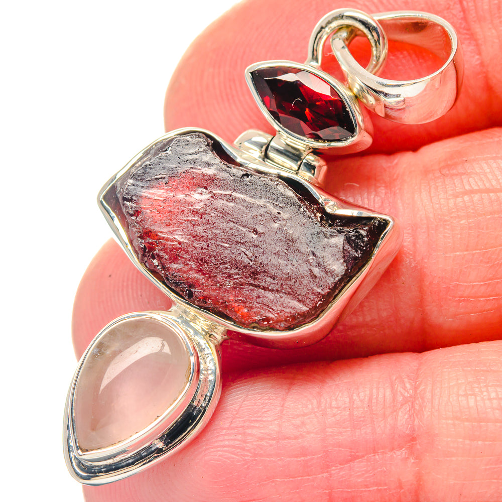 Sterling silver pendant with rough red garnet and rose quartz oval drop