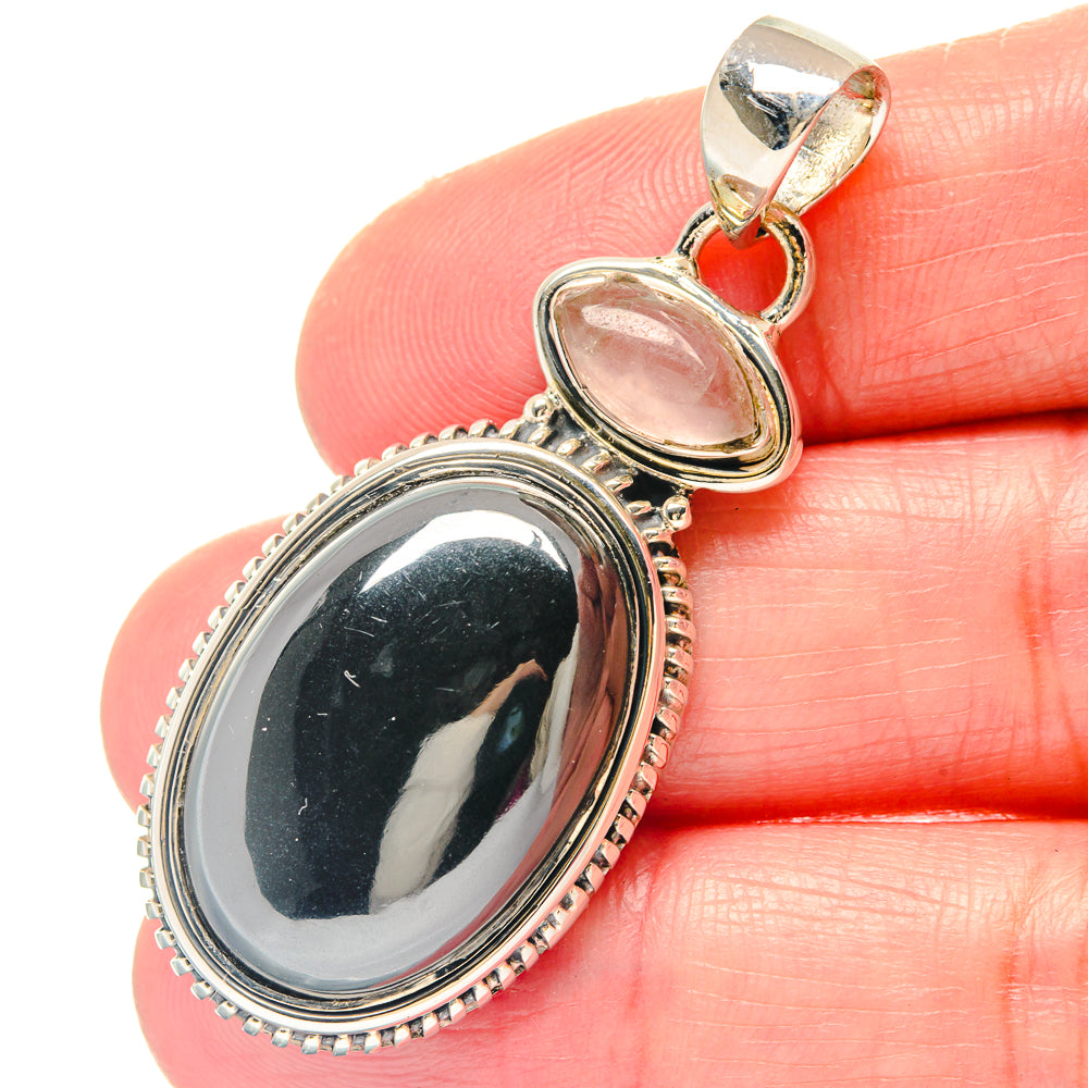 Oval hematite and rose quartz pendant close-up, 925 sterling silver beaded bezel settings
