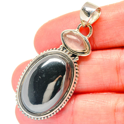 Oval hematite and rose quartz pendant close-up, 925 sterling silver beaded bezel settings