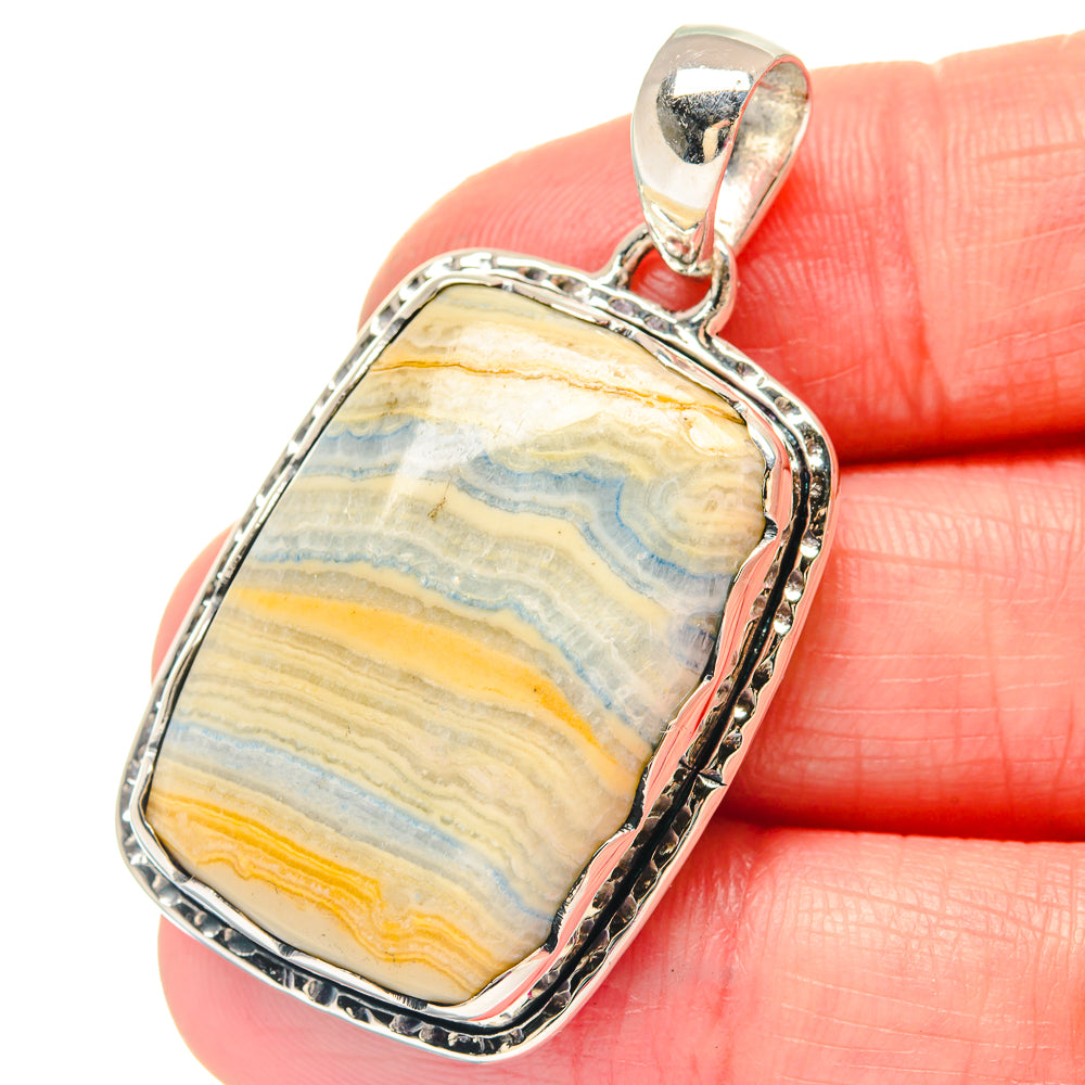 Sterling silver pendant with blue scheelite stone, rectangular bezel and loop bail