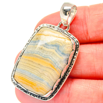 Sterling silver pendant with blue scheelite stone, rectangular bezel and loop bail