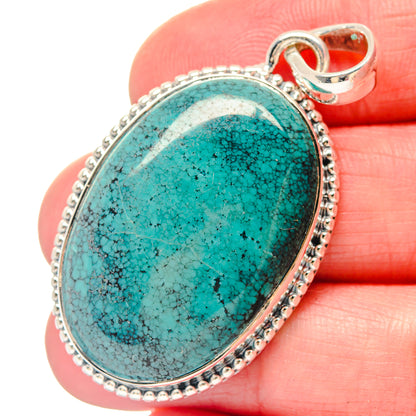 Oval turquoise stone pendant with scalloped 925 sterling silver frame and bail