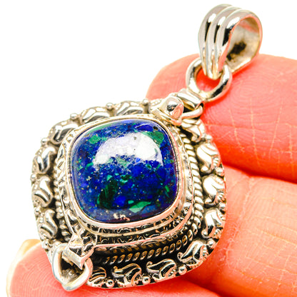 Sterling silver pendant with blue-green azurite gemstone in ornate round bezel