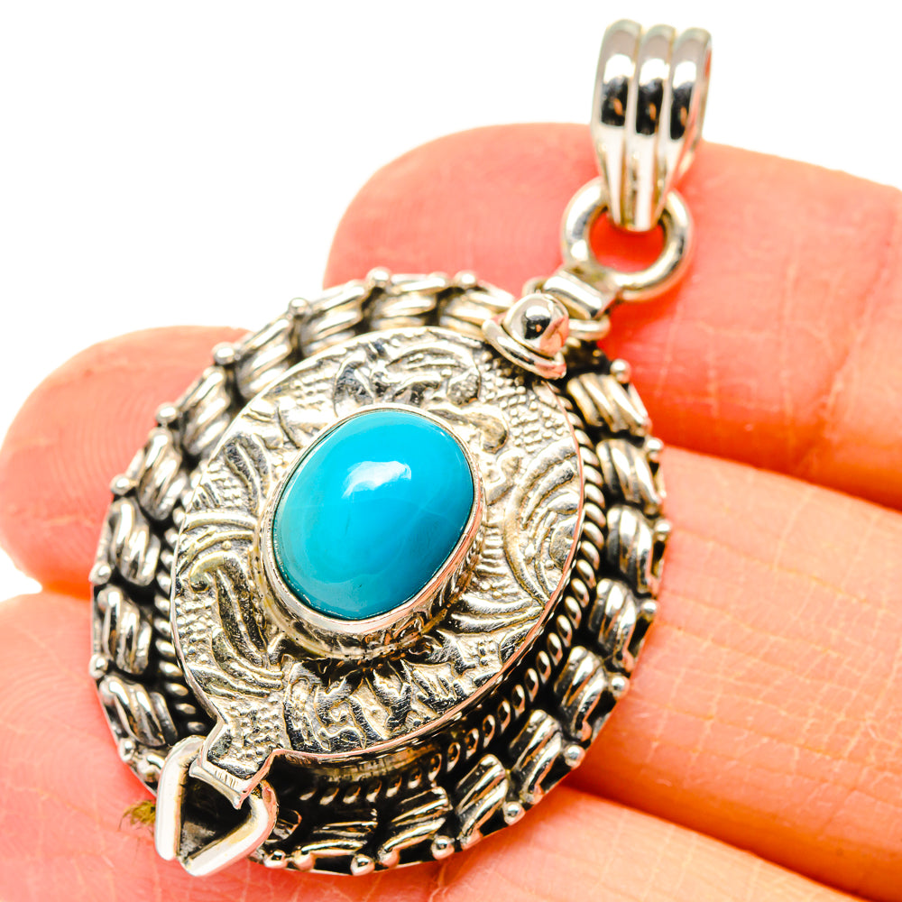 925 sterling silver pendant with oval turquoise-blue gemstone and ornate bezel