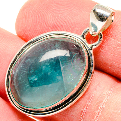 Oval aquamarine gemstone pendant in sterling silver bezel with bail