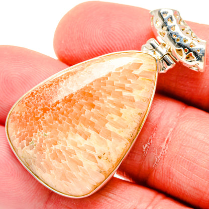 Orange peach scolecite teardrop pendant, 925 sterling silver prong setting with bail.