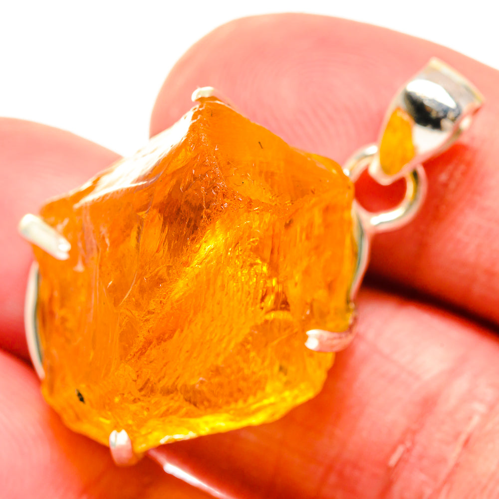 Rough citrine pendant with 925 sterling silver setting, orange-gold crystal cluster.
