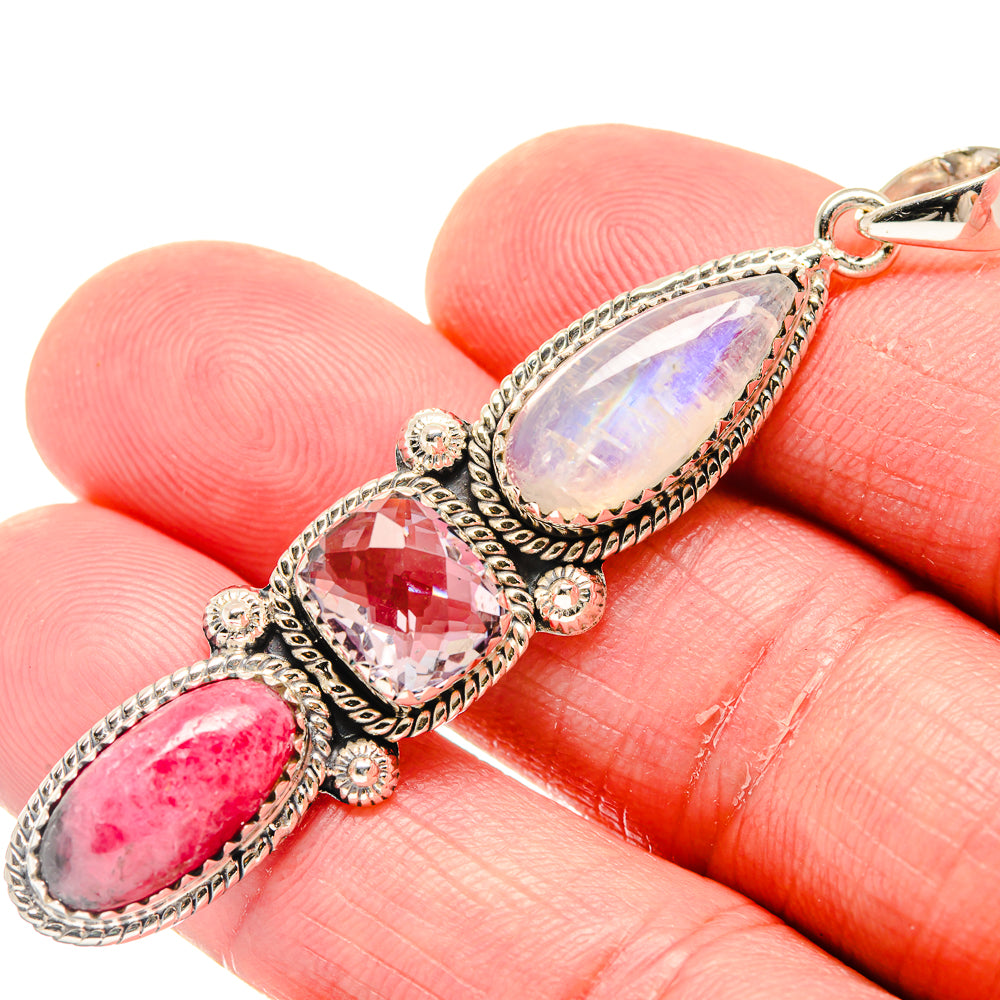 Close-up sterling silver pendant with opalescent white, pink, and lilac oval stones