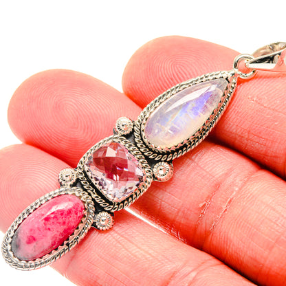 Close-up sterling silver pendant with opalescent white, pink, and lilac oval stones