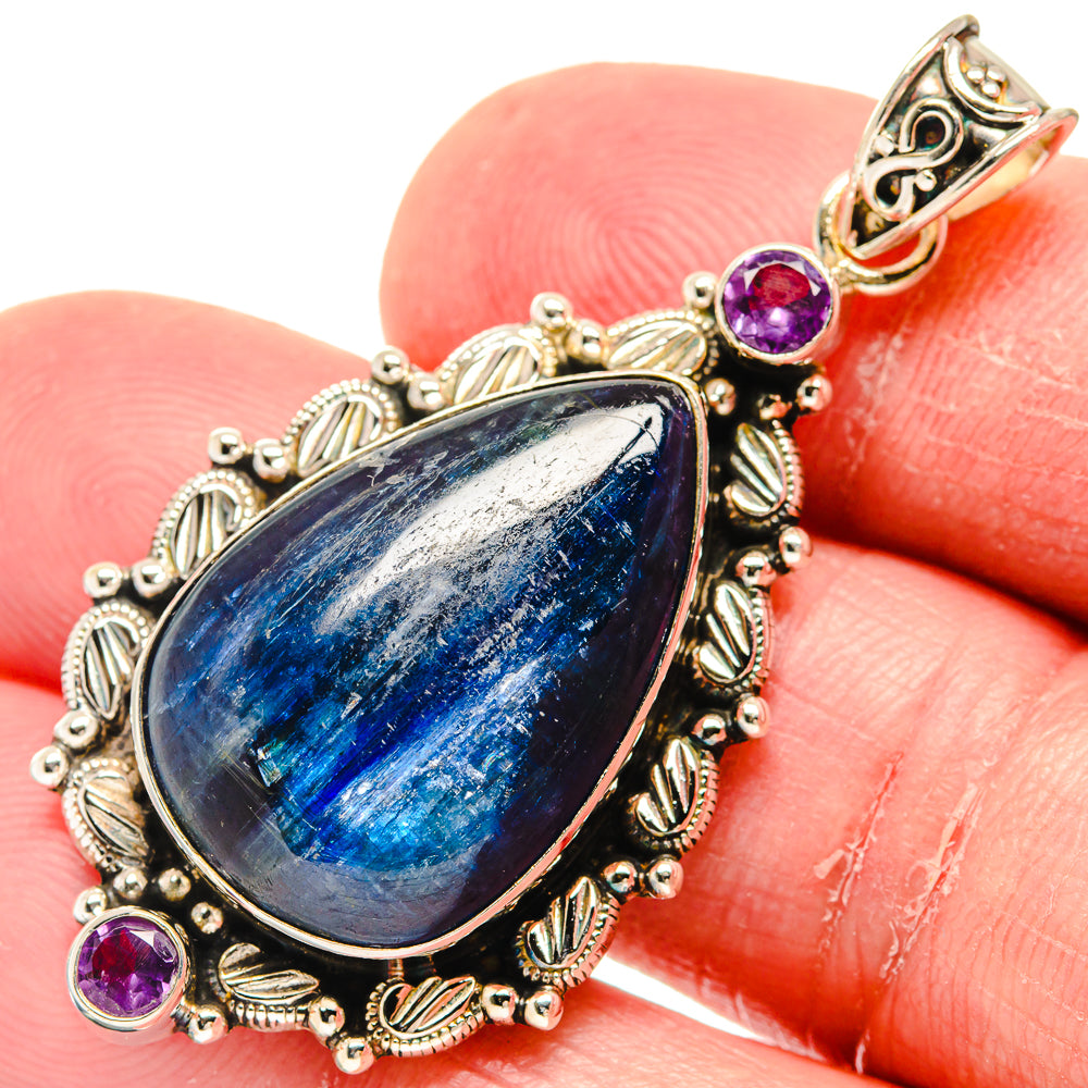 Teardrop kyanite pendant with bezel-set blue stone and round amethyst side stones