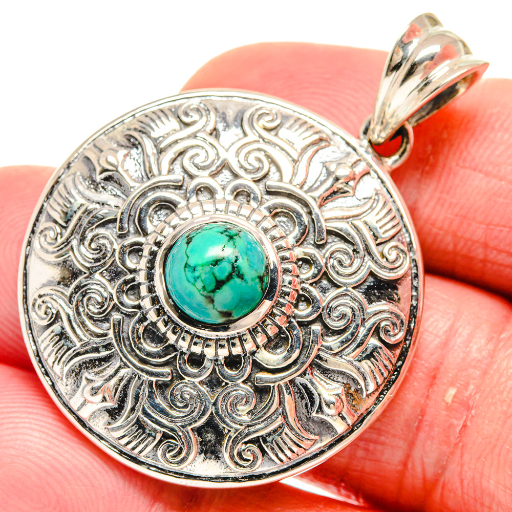 Tibetan turquoise pendant in 925 sterling silver with ornate circular filigree and cabochon