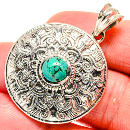 Tibetan turquoise pendant in 925 sterling silver with ornate circular filigree and cabochon
