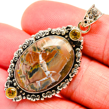 Oval butterfly jasper pendant in ornate 925 sterling silver with yellow gemstone accents