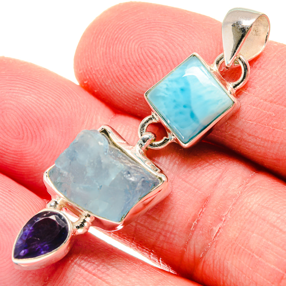 Sterling silver pendant with square turquoise gem, rough light-blue gem, and purple teardrop