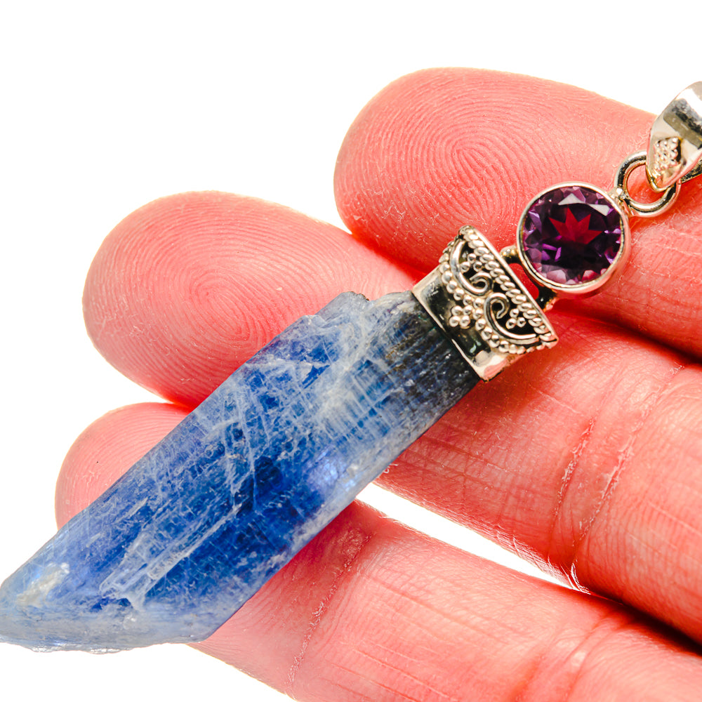Amethyst and kyanite pendant close-up, rough blue kyanite with ornate silver setting