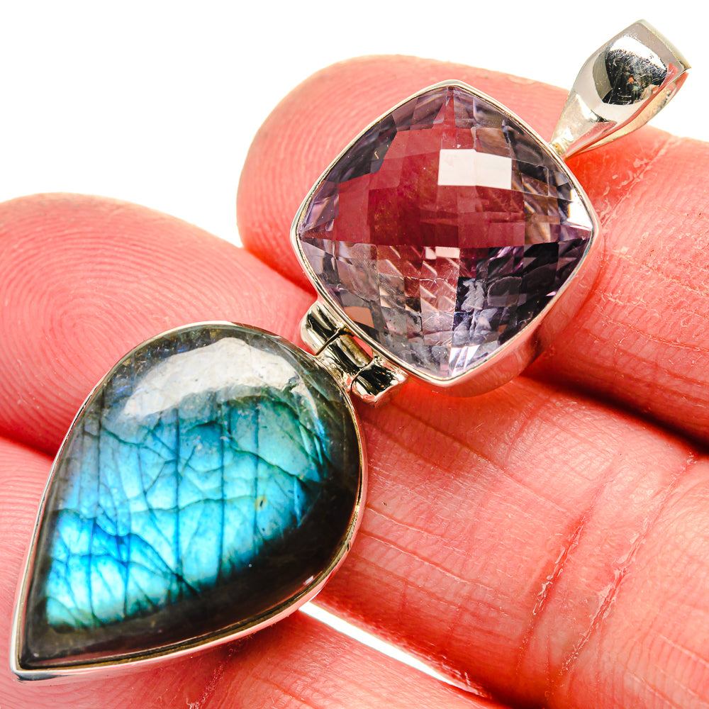Sterling silver pendant: faceted purple stone and blue-green labradorite cabochon