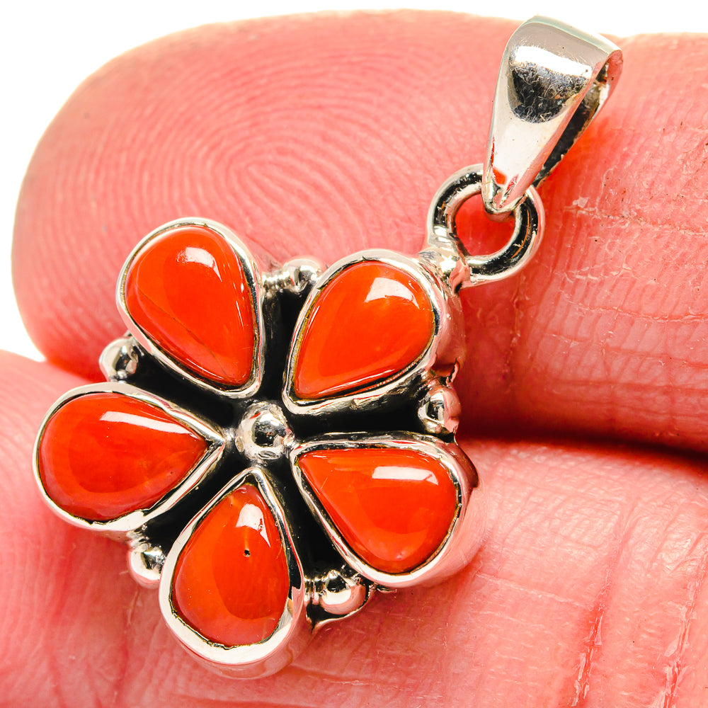 Close-up red coral flower pendant, teardrop stones in sterling silver with bail