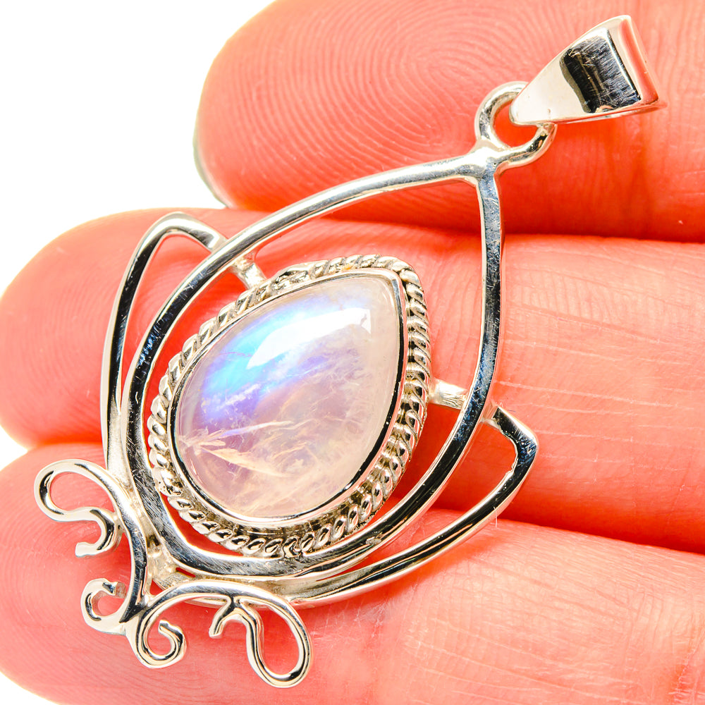 Sterling silver rainbow moonstone pendant with teardrop cabochon and ornate side filigree