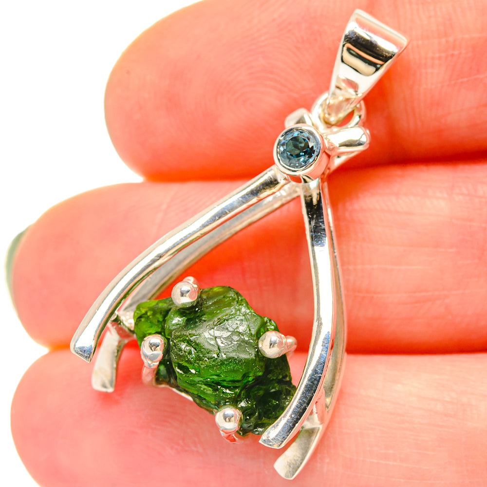 Sterling silver pendant with green chrome diopside teardrop setting and blue round accent