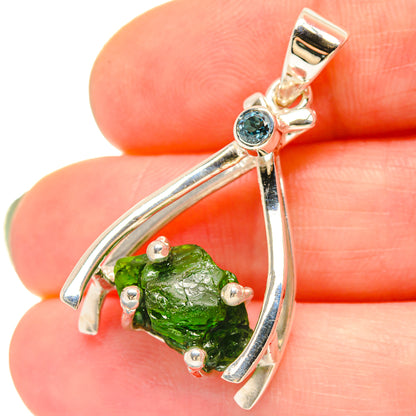 Sterling silver pendant with green chrome diopside teardrop setting and blue round accent