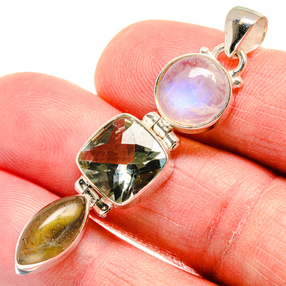 Sterling silver pendant with round lavender gem, faceted green stone, and yellow teardrop
