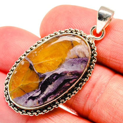 Tiffany Stone oval pendant with amber-orange and purple veined stone, silver bail