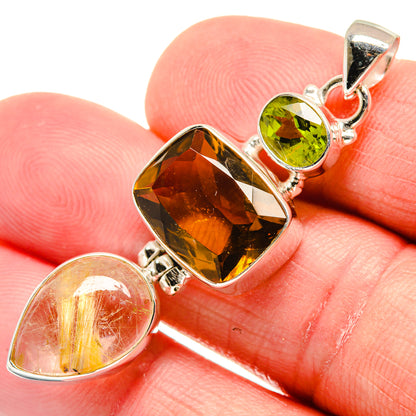 Close-up sterling silver pendant: amber marquise, peridot green oval, and citrine teardrop
