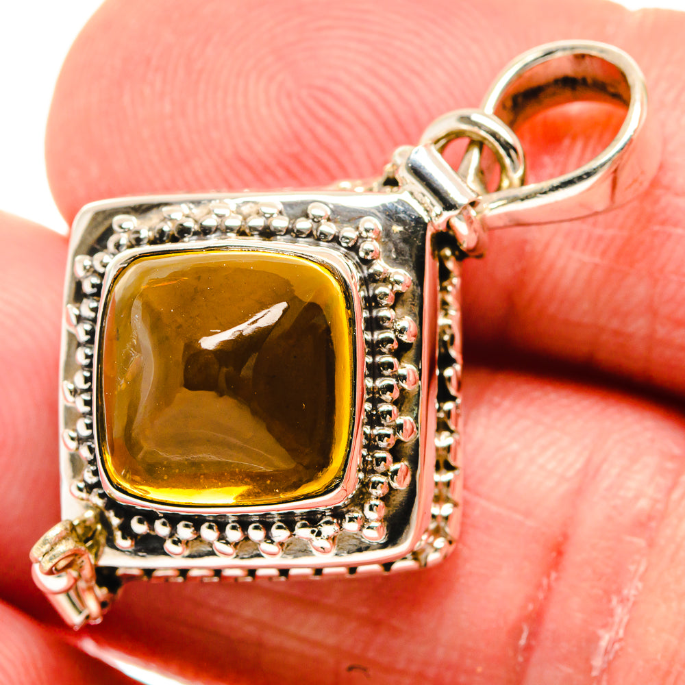 Close-up cushion-cut citrine pendant with ornate 925 sterling silver bezel and bail