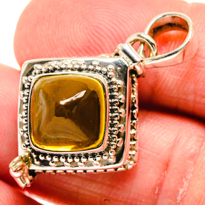 Close-up cushion-cut citrine pendant with ornate 925 sterling silver bezel and bail