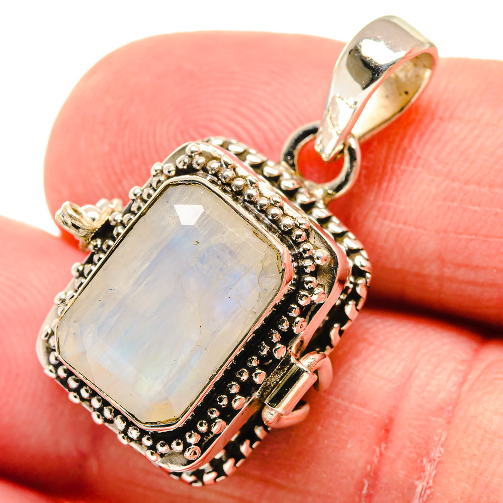 Sterling silver moonstone pendant with rectangular rainbow opalescent stone and textured frame