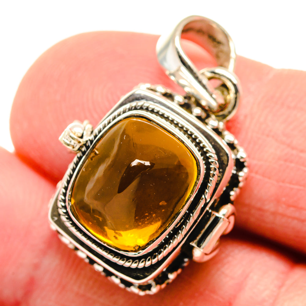 Sterling silver citrine pendant with ornate bezel and top bail, amber square gemstone