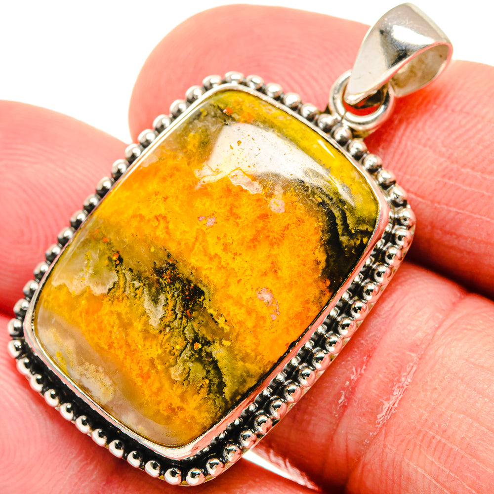 Sterling silver pendant with oval yellow-orange jasper cabochon and bail