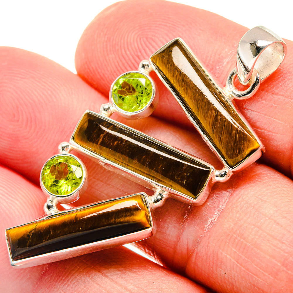Tiger eye bar pendant with round peridot stones, sterling silver bail