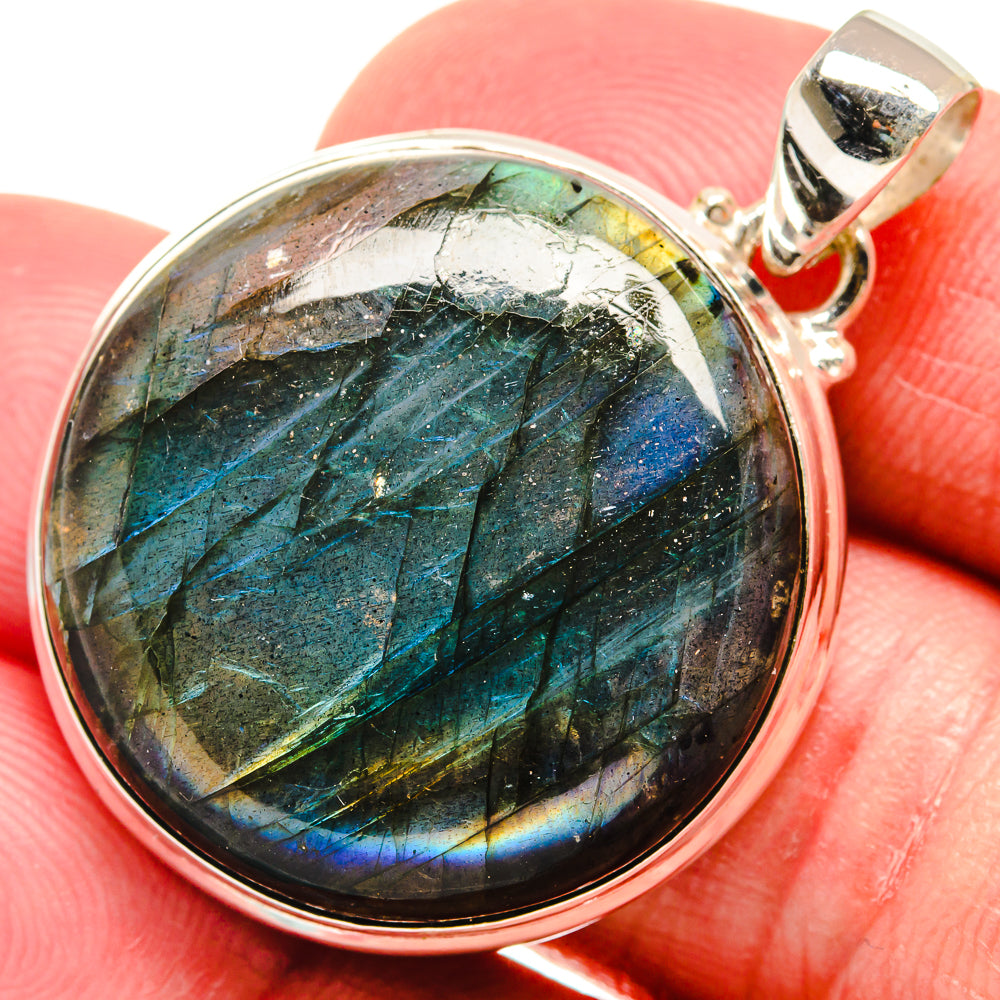 Round labradorite pendant with round silver bezel and bail, vivid blue and green flash