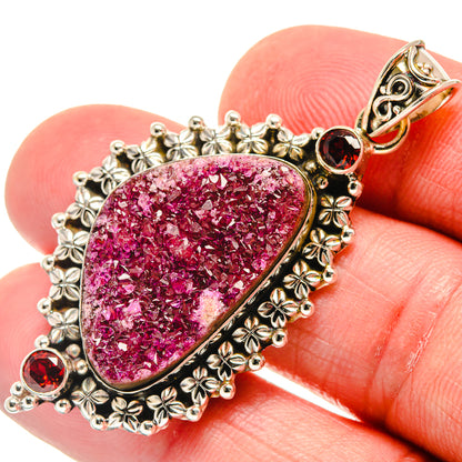 Teardrop druzy pendant in pink with ornate 925 sterling silver bezel and red garnet accents