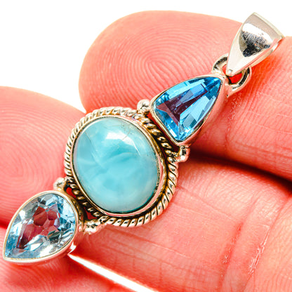 Oval larimar pendant in gold-tone bezel with blue topaz marquise and teardrop stones