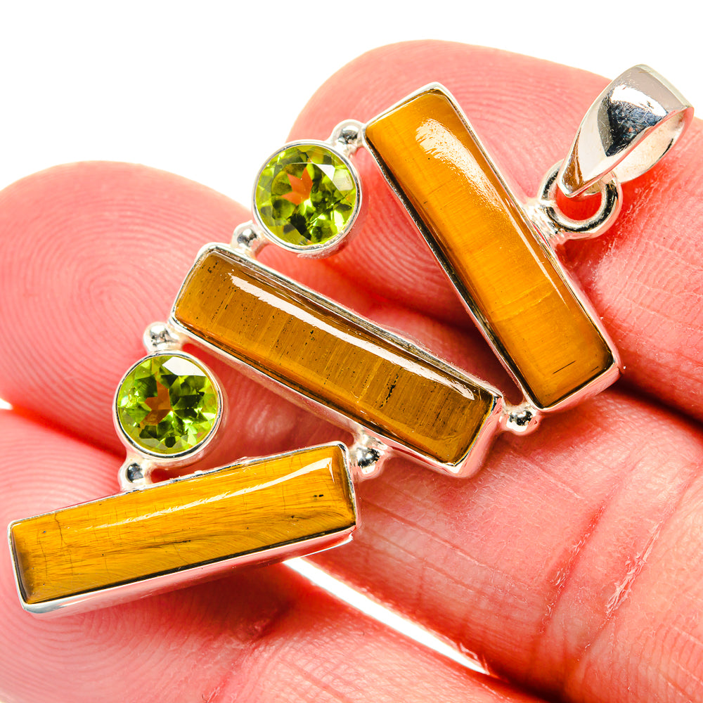 925 sterling silver pendant with orange tiger eye bars and green peridot round stones