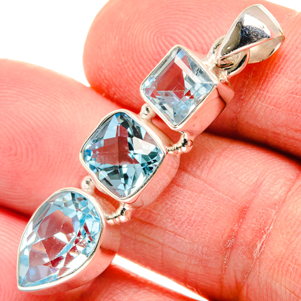 Sterling silver pendant with three faceted sky-blue topaz stones and bail